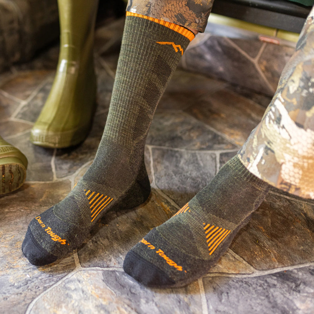 Men's hunting boot socks worn with rubber boots, photographed on the foot