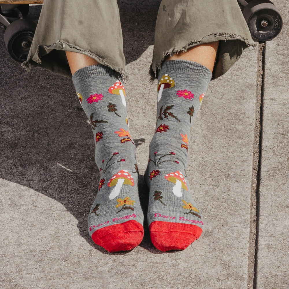 Person wearing Shroom Bloom socks in seafoam in lifestyle setting