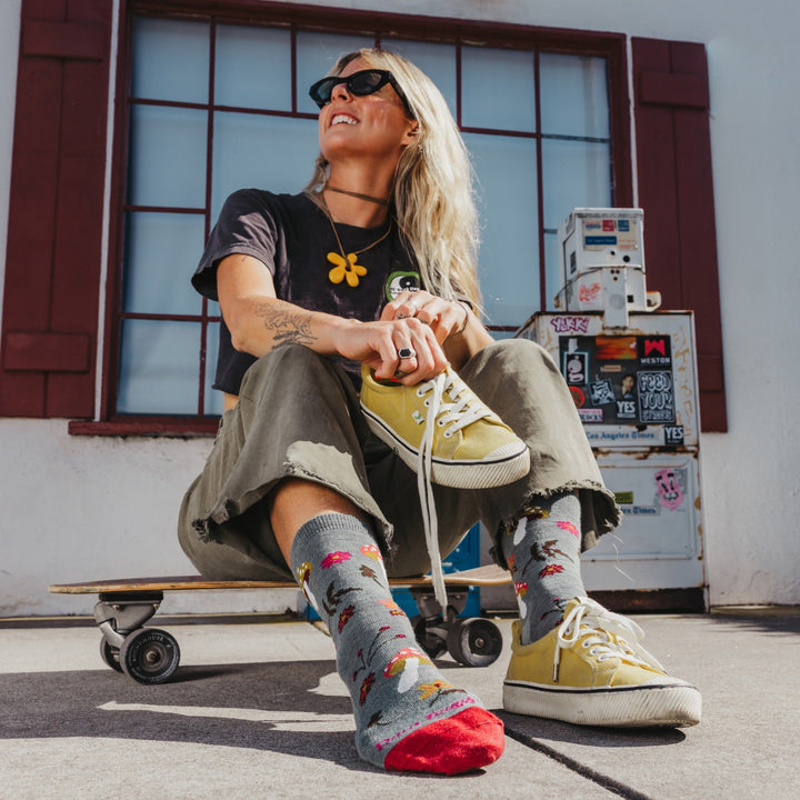 Shroom Bloom seafoam socks left foot detail on skateboard