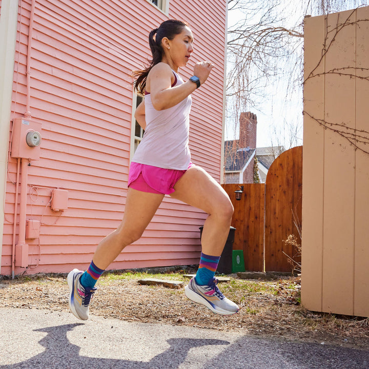 Woman running outdoors wearing women&