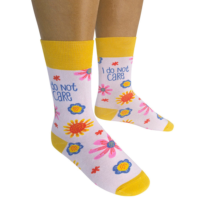 Person wearing I Do Not Care socks in casual lifestyle setting
