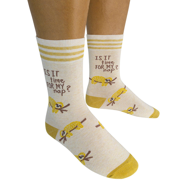 Person wearing nap time socks with sloth design in lifestyle photo