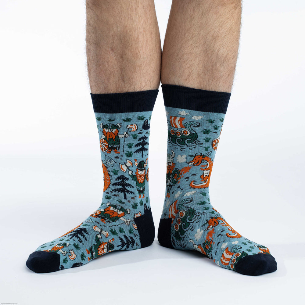 Men's Viking crew socks worn, studio view of the longship pattern on the leg