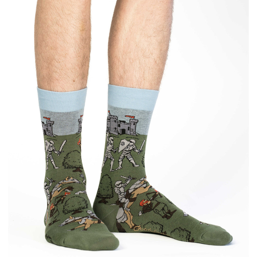 Men's medieval knights crew socks worn, studio view of the castle and knight pattern on the leg