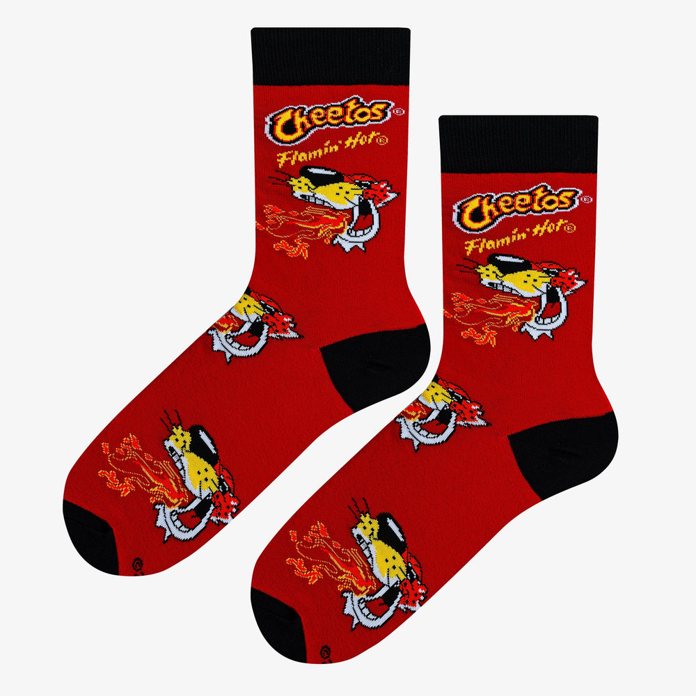 Men's Cheetos Flamin' Hot crew socks flat lay top view on red