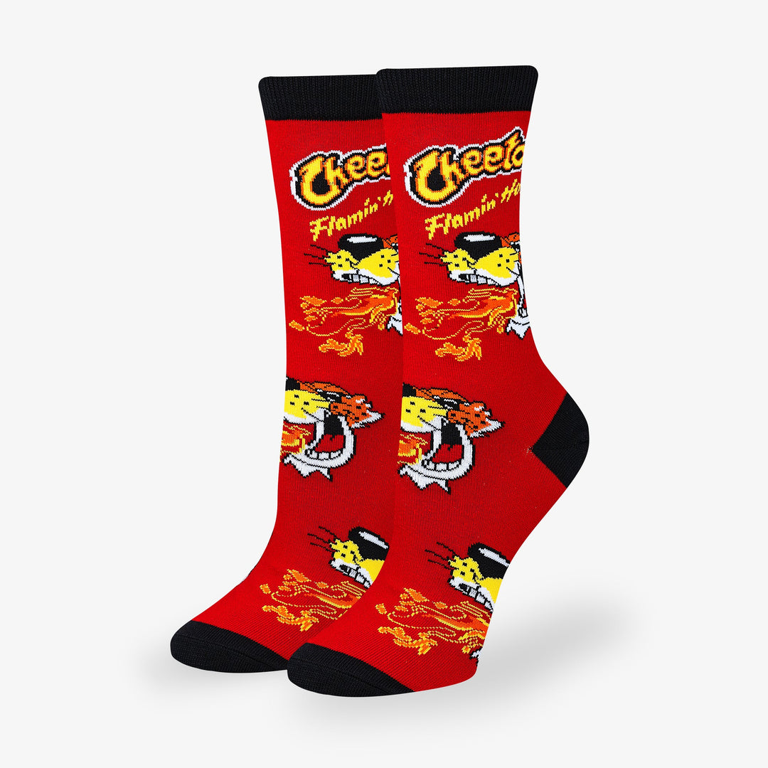 Women's Cheetos Flamin' Hot crew socks laid flat with Chester Cheetah and flames