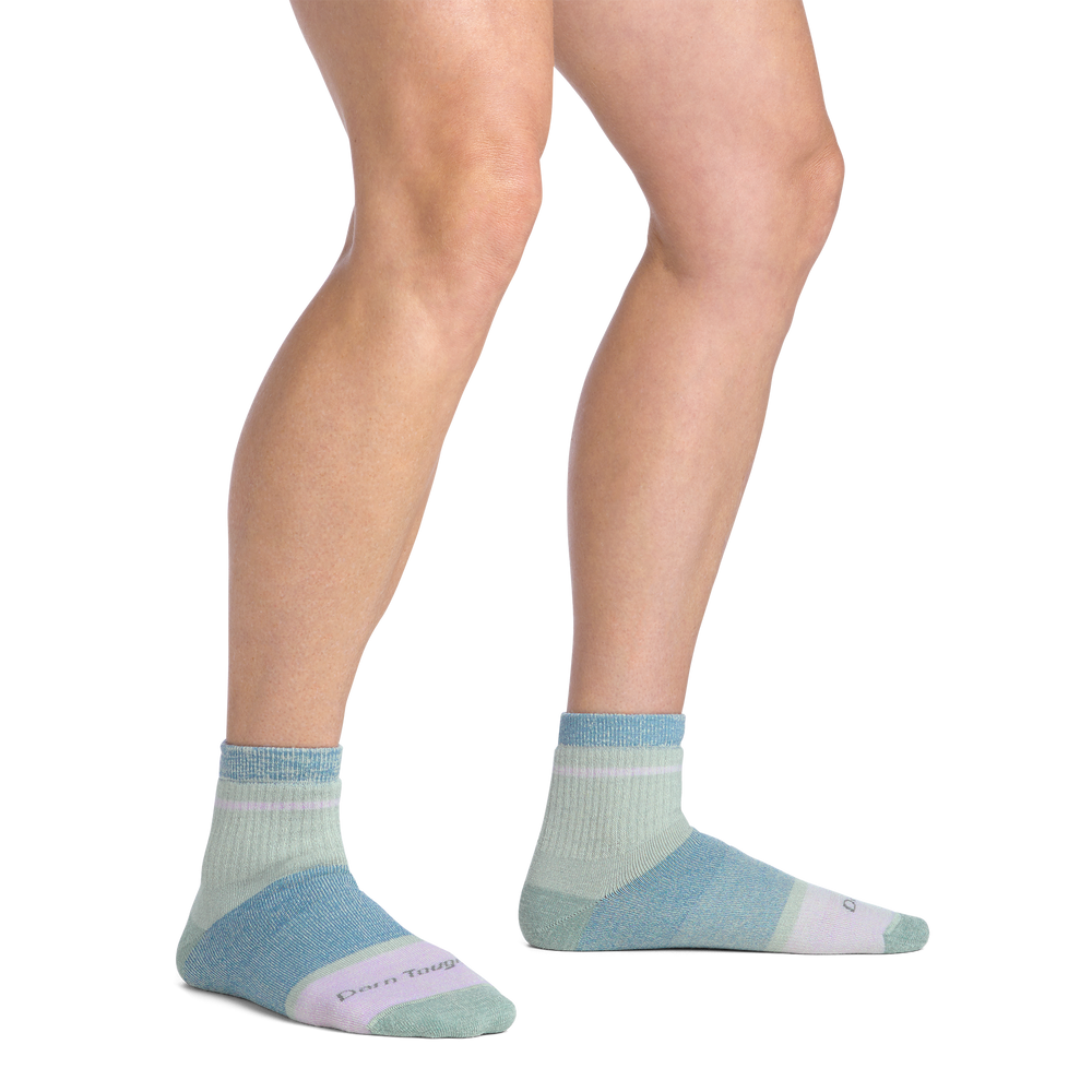 Woman standing barefoot wearing women's meadow ankle socks