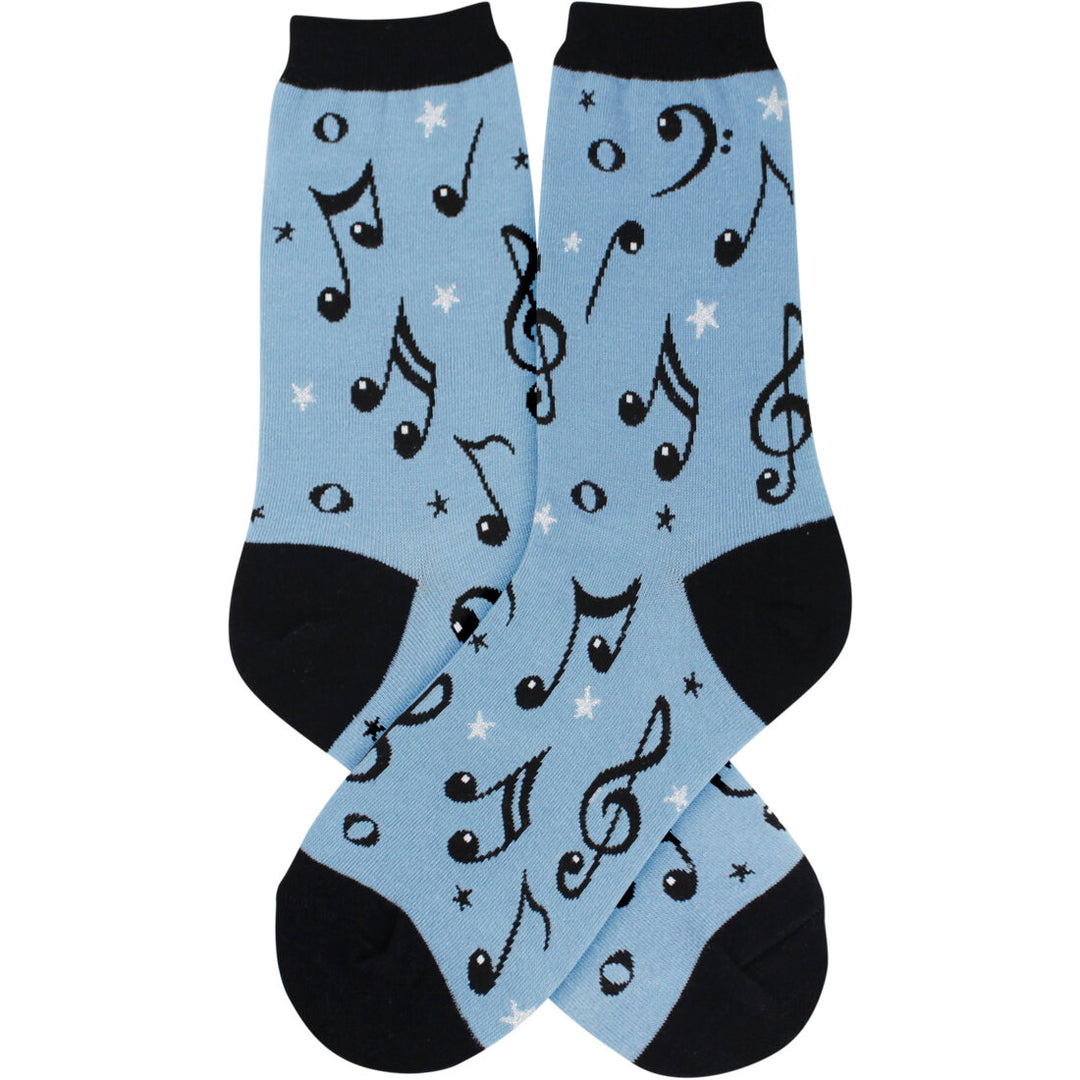 Women's music note crew socks with black notes and silver stars on light blue, flat product shot