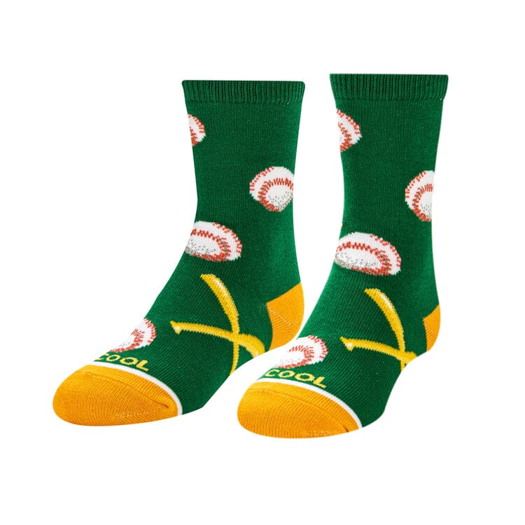 Kids' baseball crew socks laid flat on green with white baseballs and yellow bats