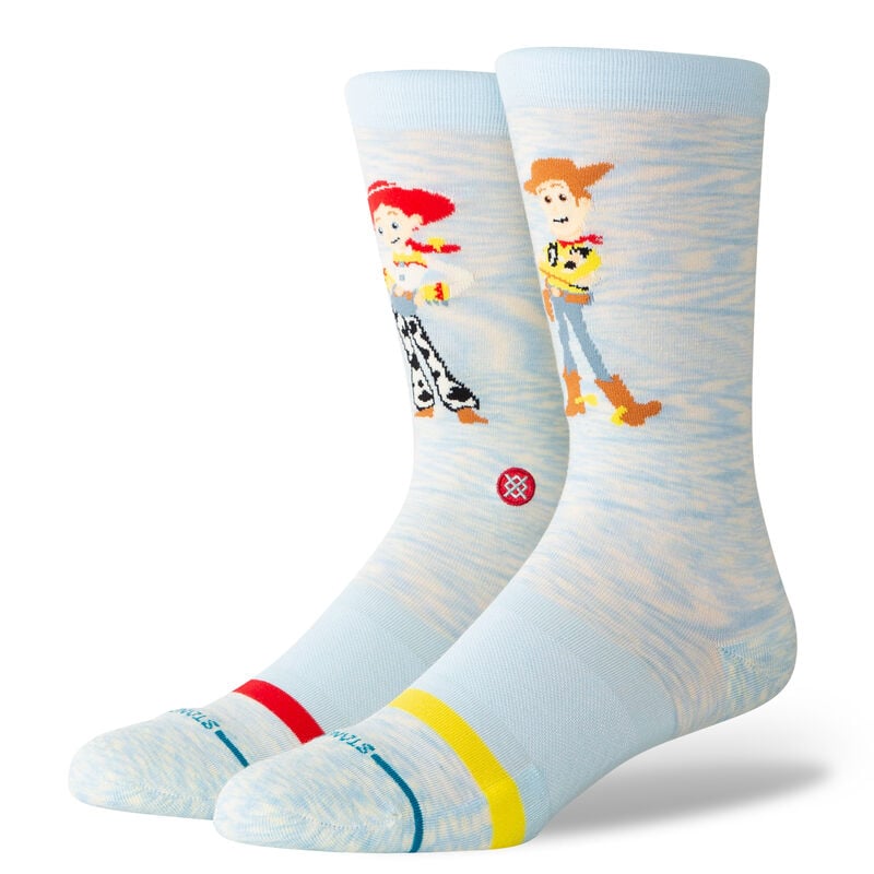 Women's Toy Story crew socks worn, light blue with Woody and Jessie