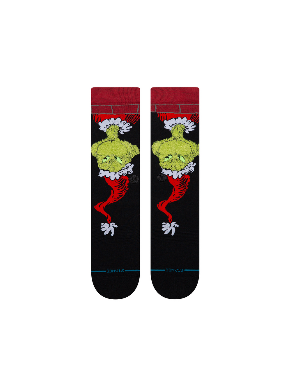Men's Down The Chimney crew socks in black with the Grinch in a Santa suit sliding down a brick chimney, flat front view of the pair