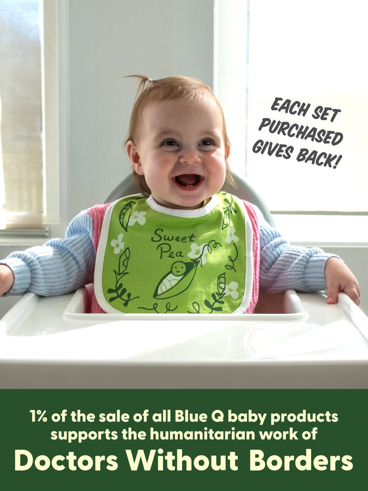 Baby in a high chair wearing the green Sweet Pea kids&