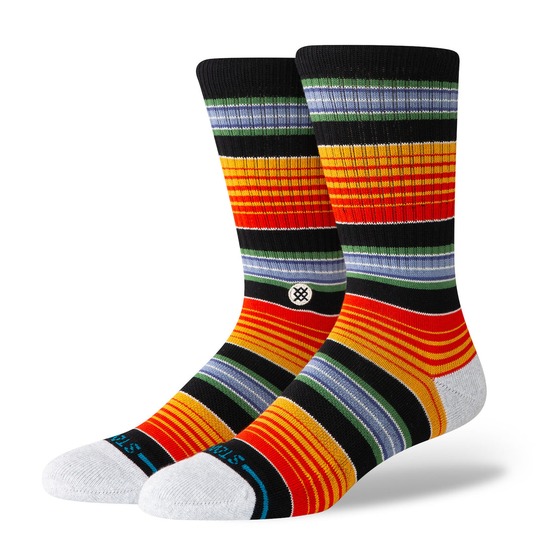 Men's serape-striped crew socks, flat front pair view, multicolor warm stripes with white toes on black