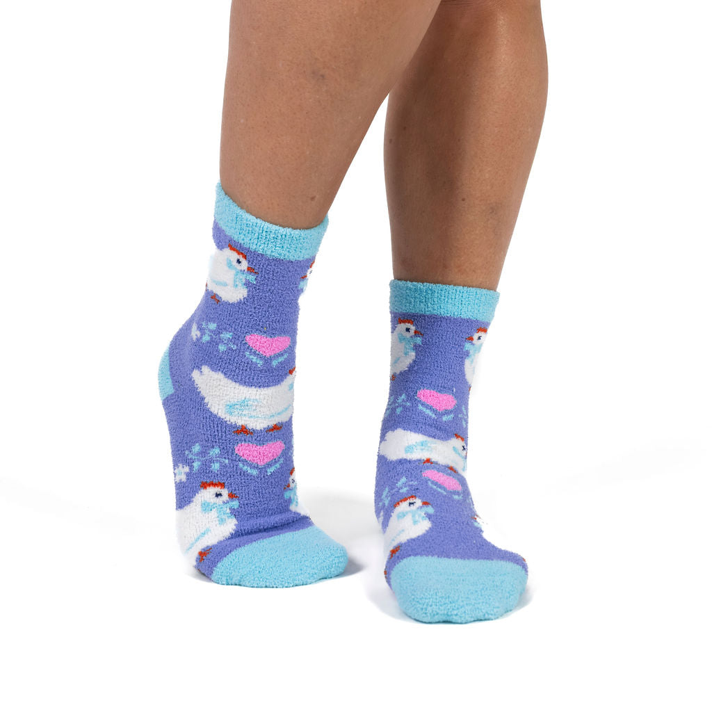 Henny Penny women's slipper socks with country hens, model side view