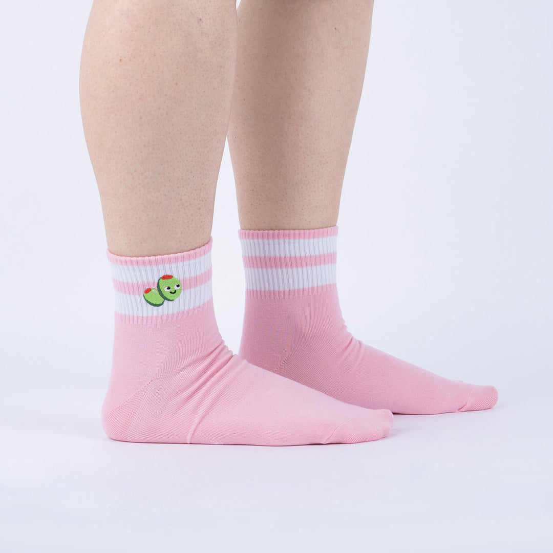 Women's olive quarter crew socks worn, side view showing embroidered olives and white stripes