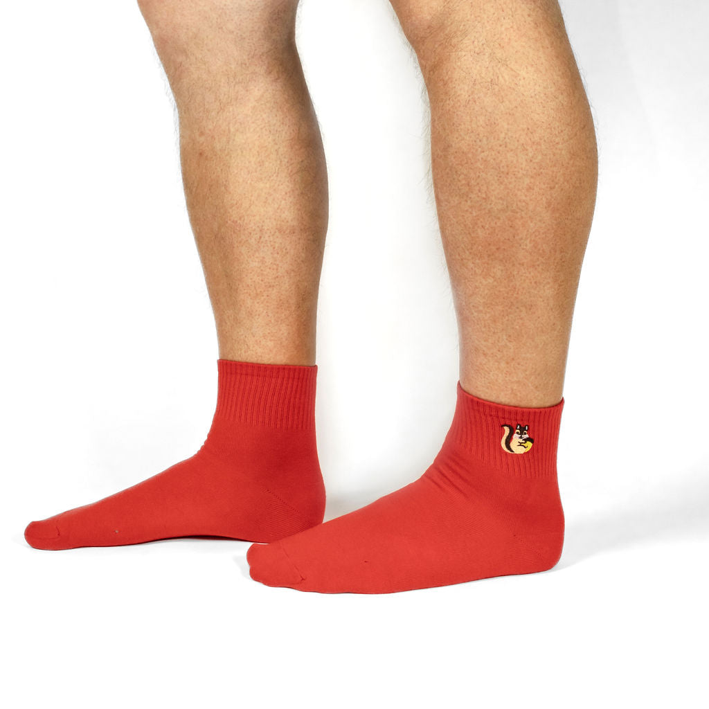 Up To Nuttin' women's quarter crew socks with squirrels, model side view