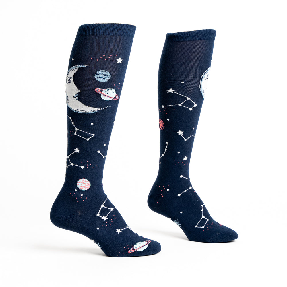 Women's space knee high socks, flat pair showing moon and constellation design