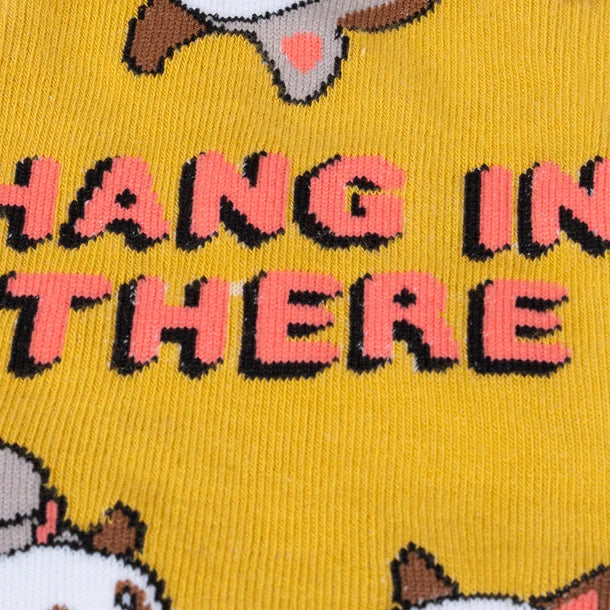 Women's opossum knee-high socks, close-up detail, 'Hang In There' lettering with opossums