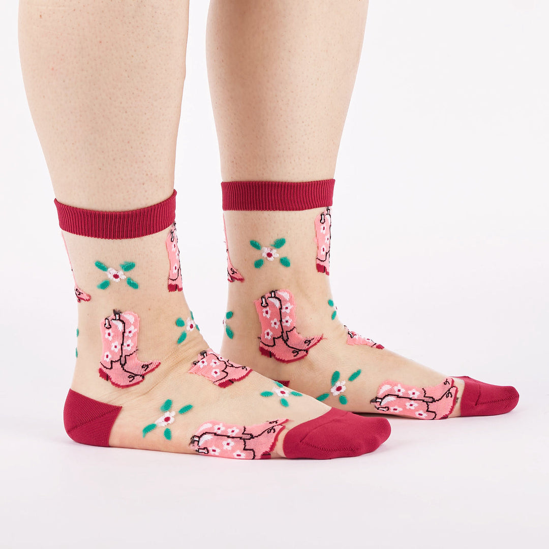 Women's cowboy boot sheer crew socks worn, side view showing pink floral boots on mesh