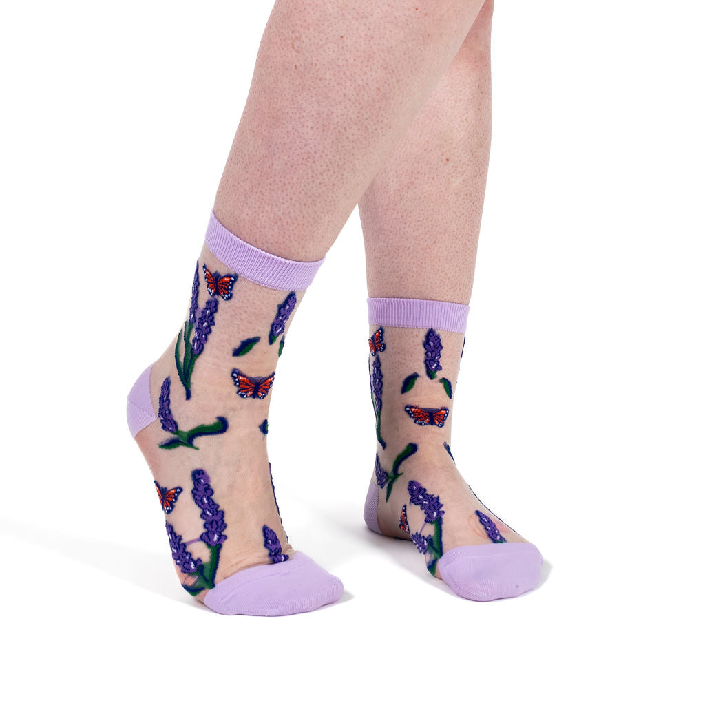 Never Herb Your Enthusiasm women's sheer crew socks with lavender and butterflies, model side view