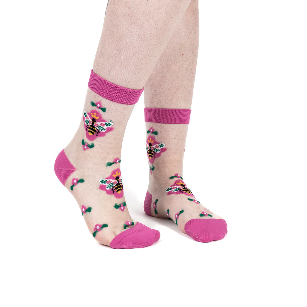 Beehive Yourself women's sheer crew socks with queen bees and flowers, model side view