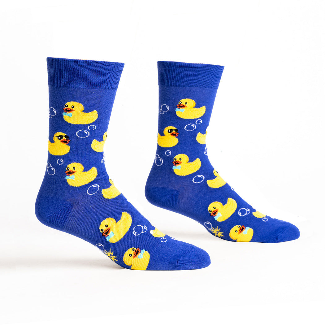 Men's rubber duckie crew socks, flat pair showing yellow ducks and bubbles on blue