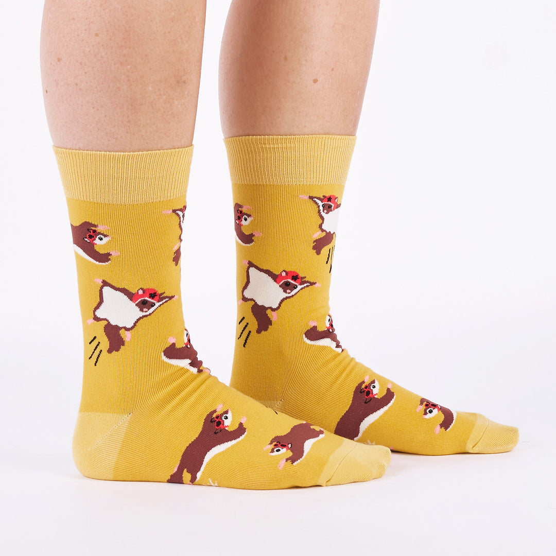Men's flying squirrel crew socks worn, side view showing gliding squirrels in goggles