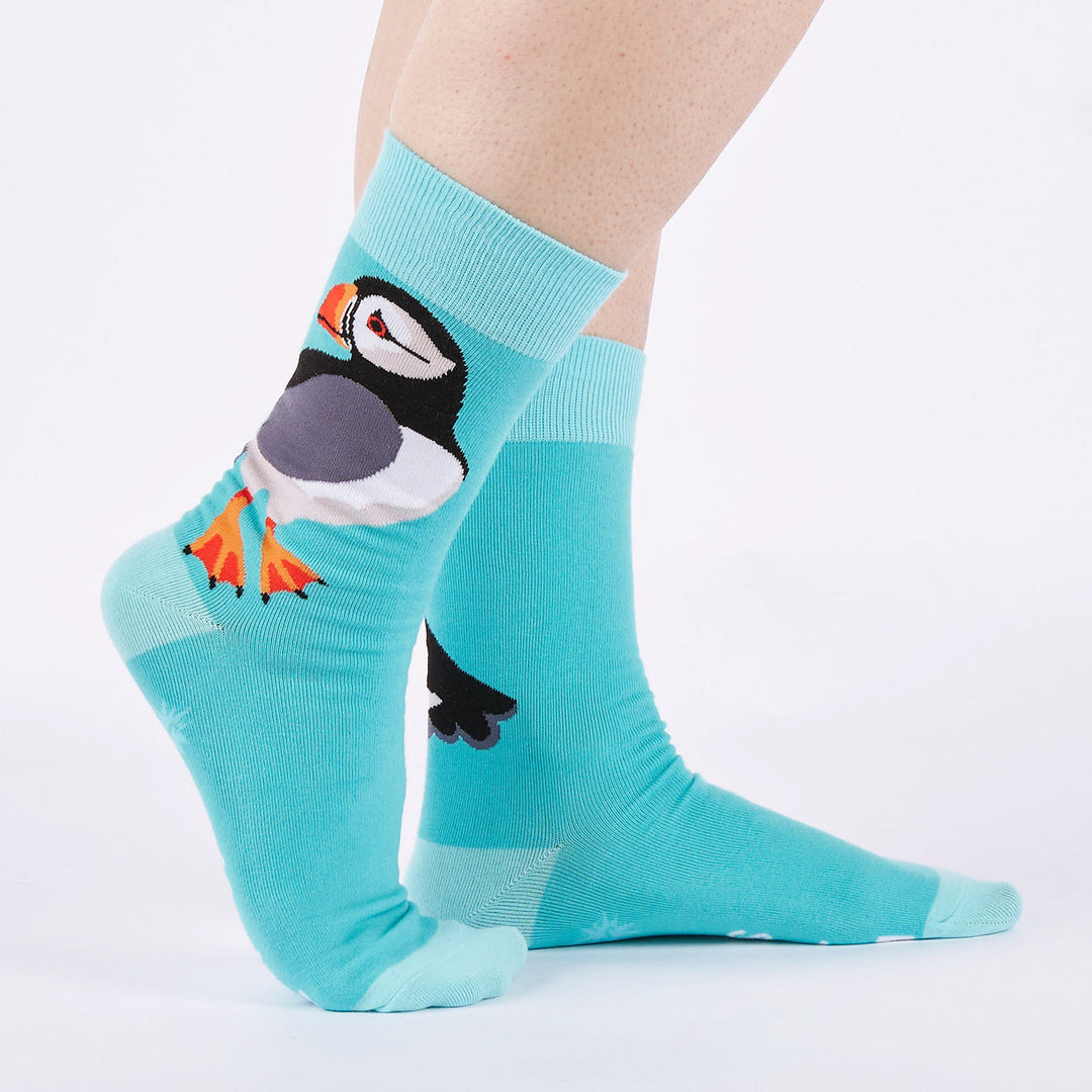 Men's puffin crew socks worn, side view showing large puffin on aqua