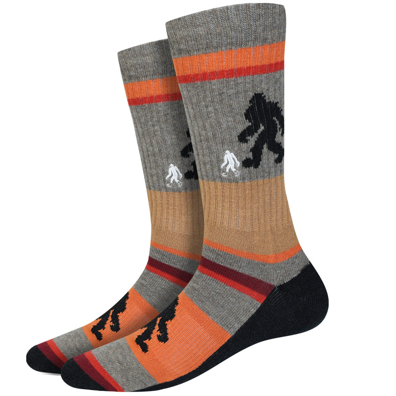 Men's active Bigfoot crew socks, flat pair view with Sasquatch silhouette and orange stripes on gray