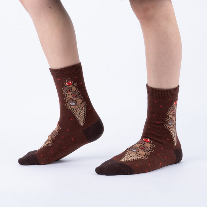 Child wearing brown capybara ice cream cone junior crew socks, side view