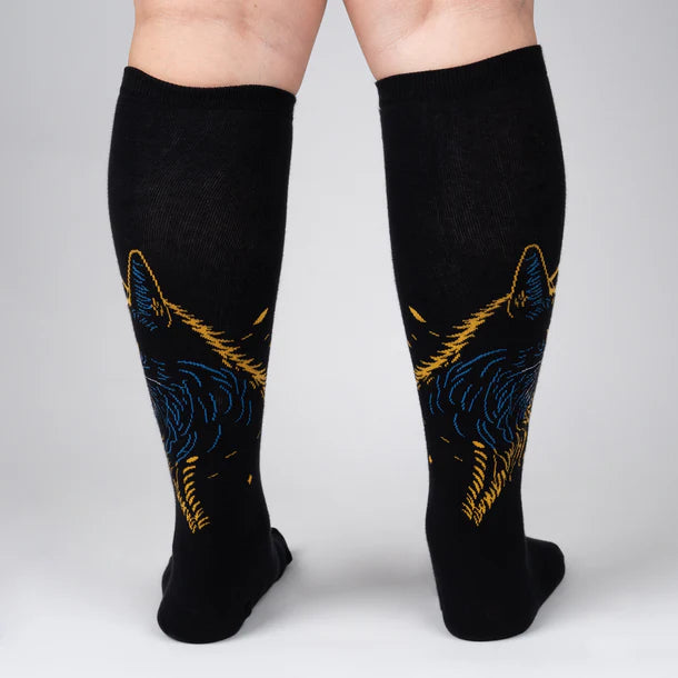 Women's cat knee-high socks worn, back view of gold and blue cat face design