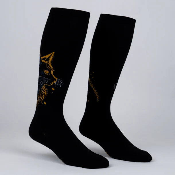 Women's cat knee-high socks flat lay, black with golden and blue feline face