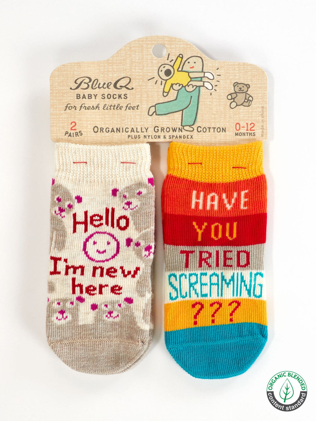 Blue Q’s "Hello I'm New Here/Have You Ever Tried Screaming???" baby socks (ages 0–12 months) include a beige pair with a smiley face and saying, plus a colorful striped pair. Made from OCS certified organic cotton.