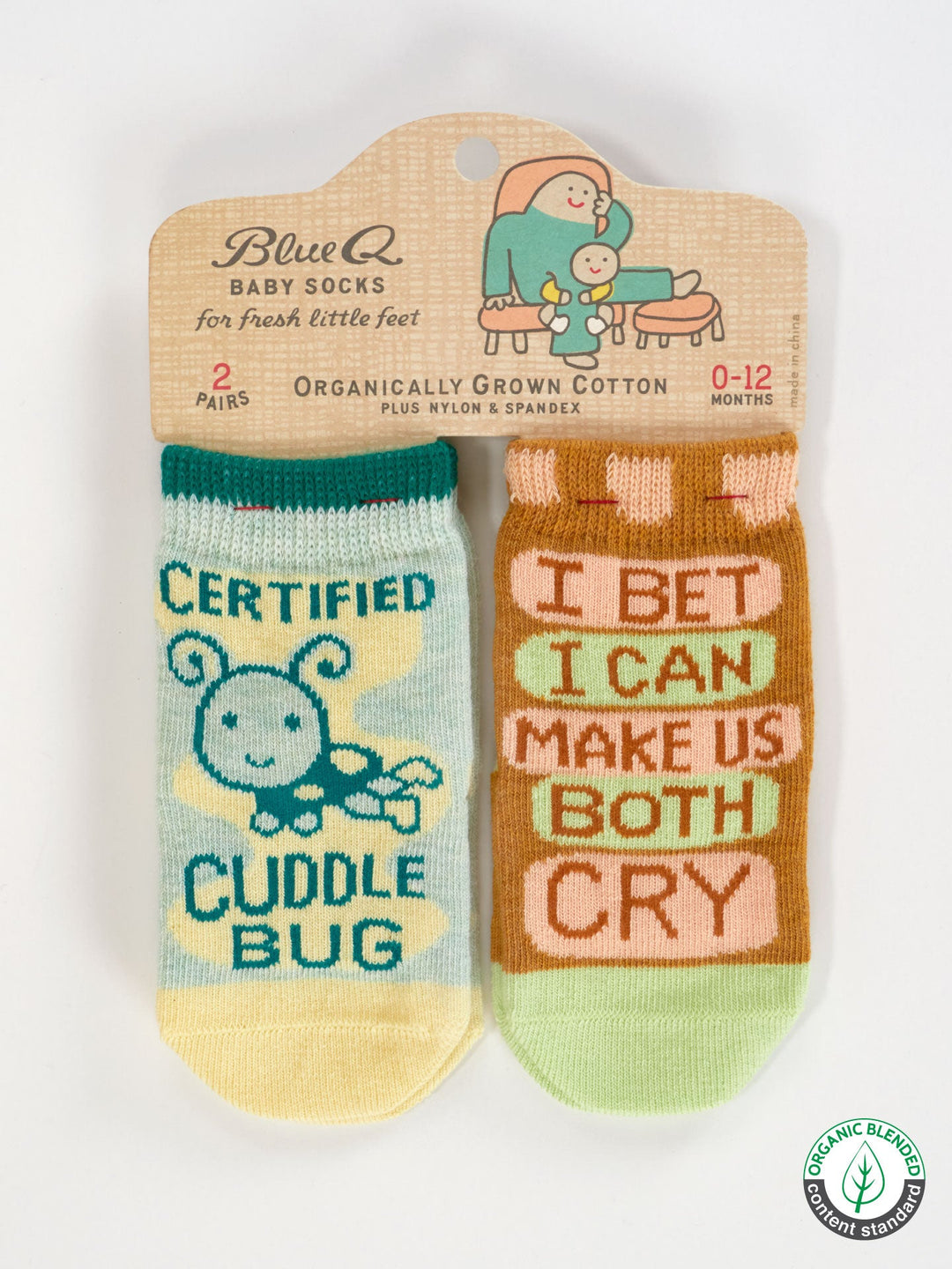 Blue Q Certified Cuddle Bug/I Bet I Can Make Us Both Cry Baby Socks—two colorful, organic cotton pairs (OCS Certified) for 0-12 months on a hanger. One features a smiling blue bug; the other says "I Bet I Can Make Us Both Cry.