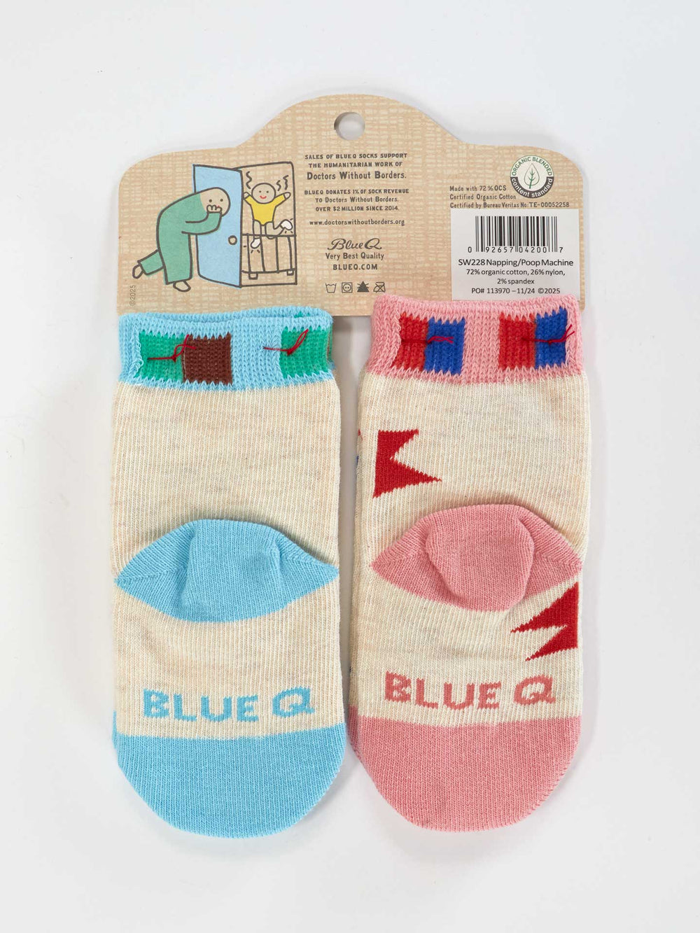 Two pairs of Blue Q "Napping? In This Economy?/Poop Machine Baby Socks," made of soft organic cotton: cream/blue with chocolate bar, and cream/pink with strawberry milk. Both say "BLUE" and come in cute cartoon packaging—perfect for nap time comfort.