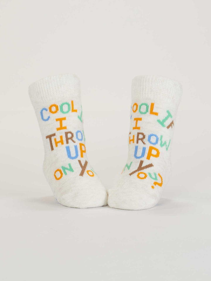 Blue Q’s “Cool If I Throw Up On You?” baby socks are made from OCS certified organic cotton and feature white fabric with colorful lettering on the front.