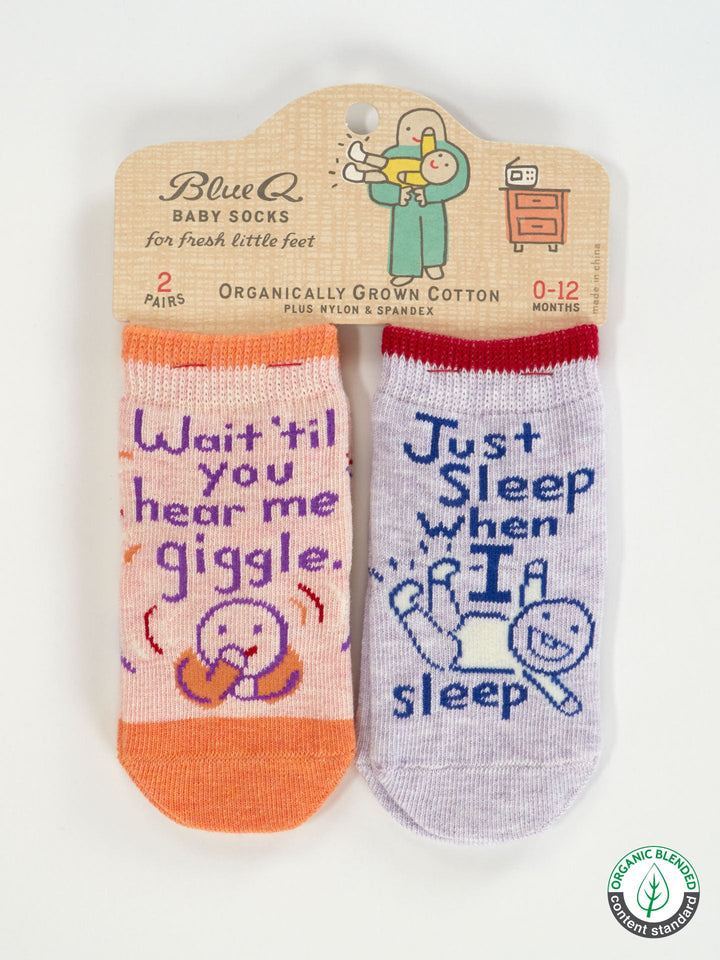 Two pairs of Blue Q baby socks: one orange with "Wait &
