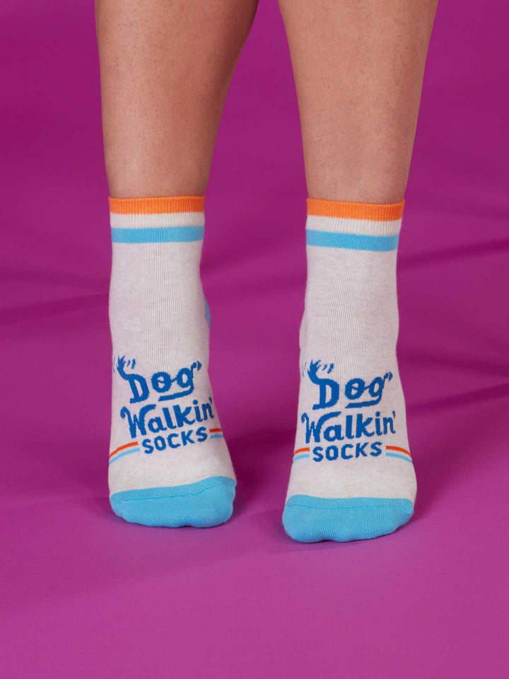 A person wears Blue Q Dog Walkin&