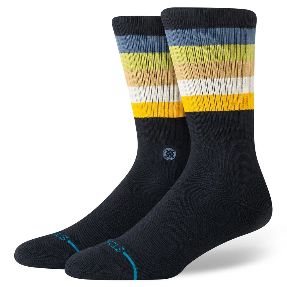 Men's striped crew socks in black with blue, green and yellow cuff stripes, flat pair angled shot