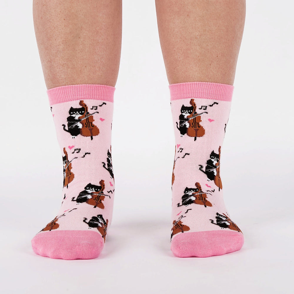 Women's musical cat crew socks worn, front view on legs