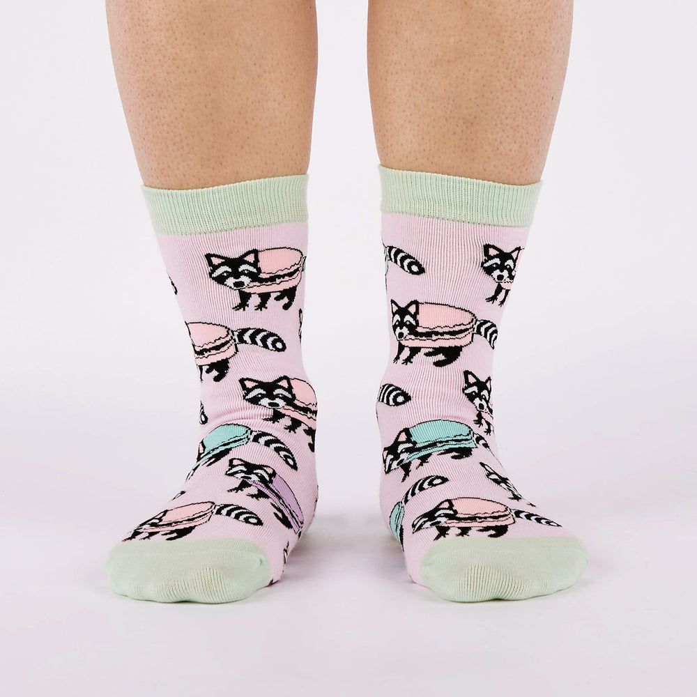 Women's macaron raccoon crew socks worn, front view on legs