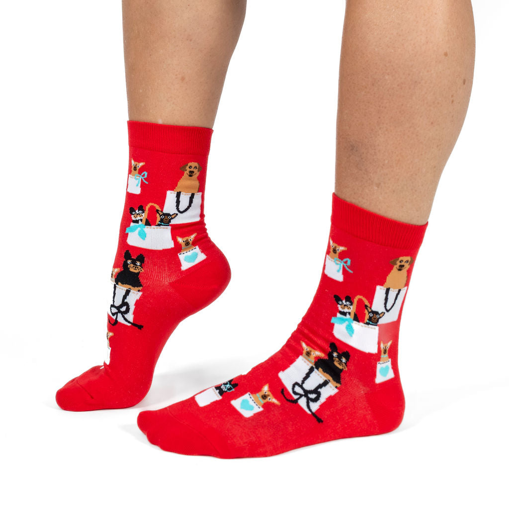 Doggie Bag women's crew socks with dogs in tote bags, model side view