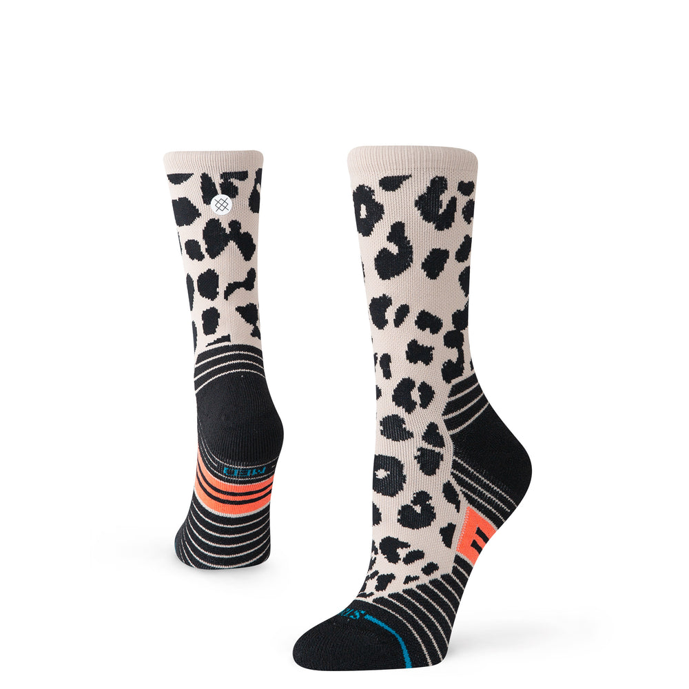 Women's tan leopard print performance crew socks, angled worn view