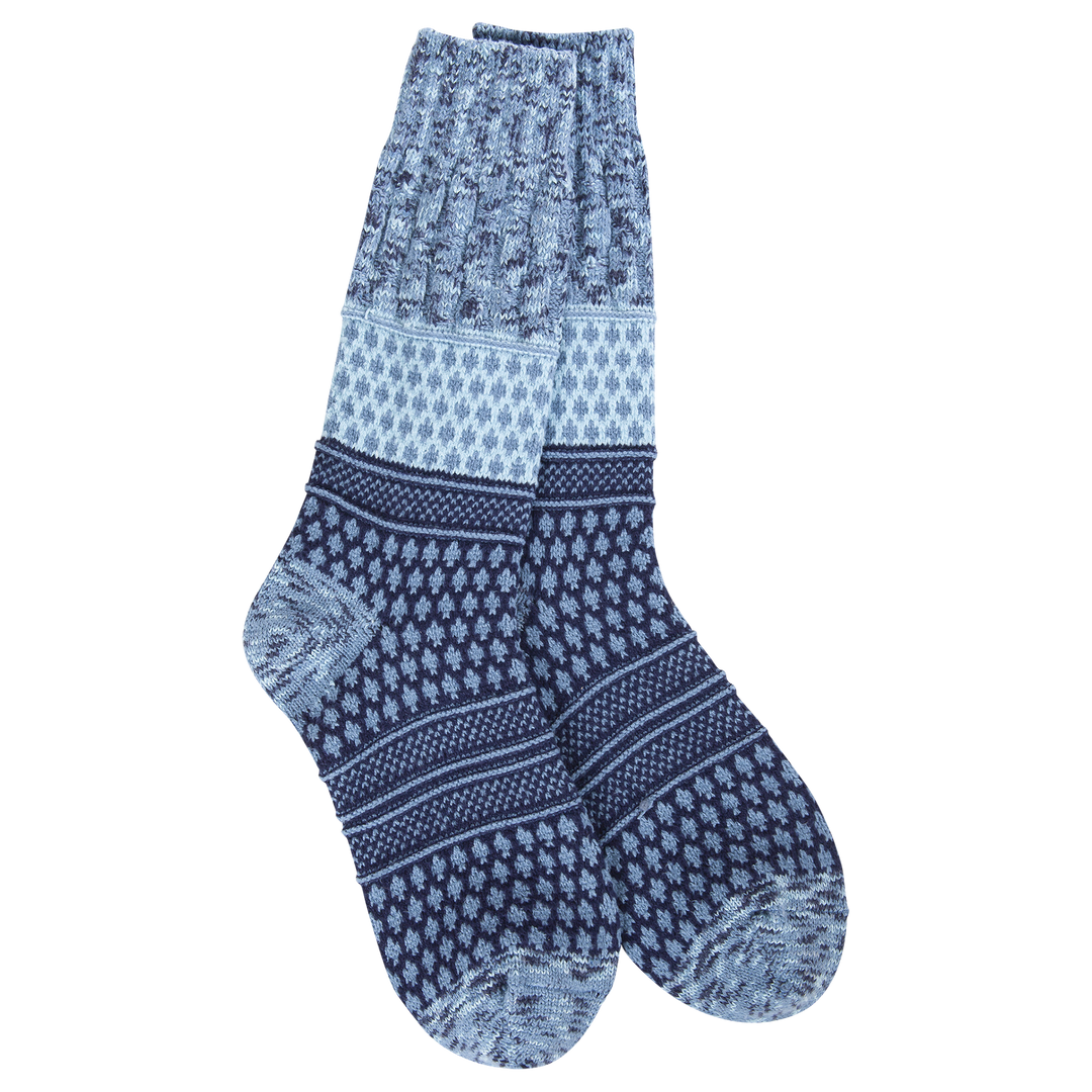 Women's navy and white multi-pattern textured crew socks, flat lay on black