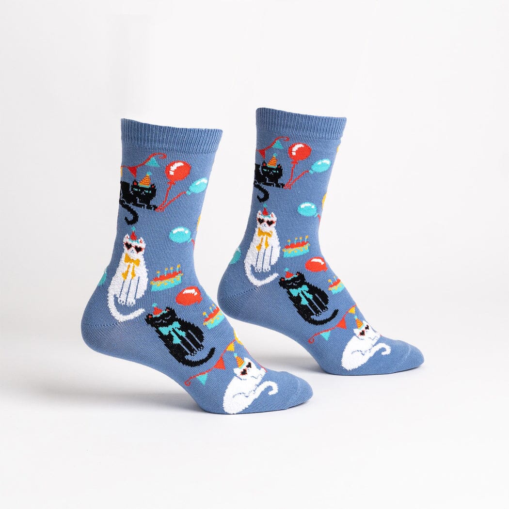 Women's A Purr-fect Day fuzzy crew socks, flat pair view, party-hat cats with balloons and cake on blue