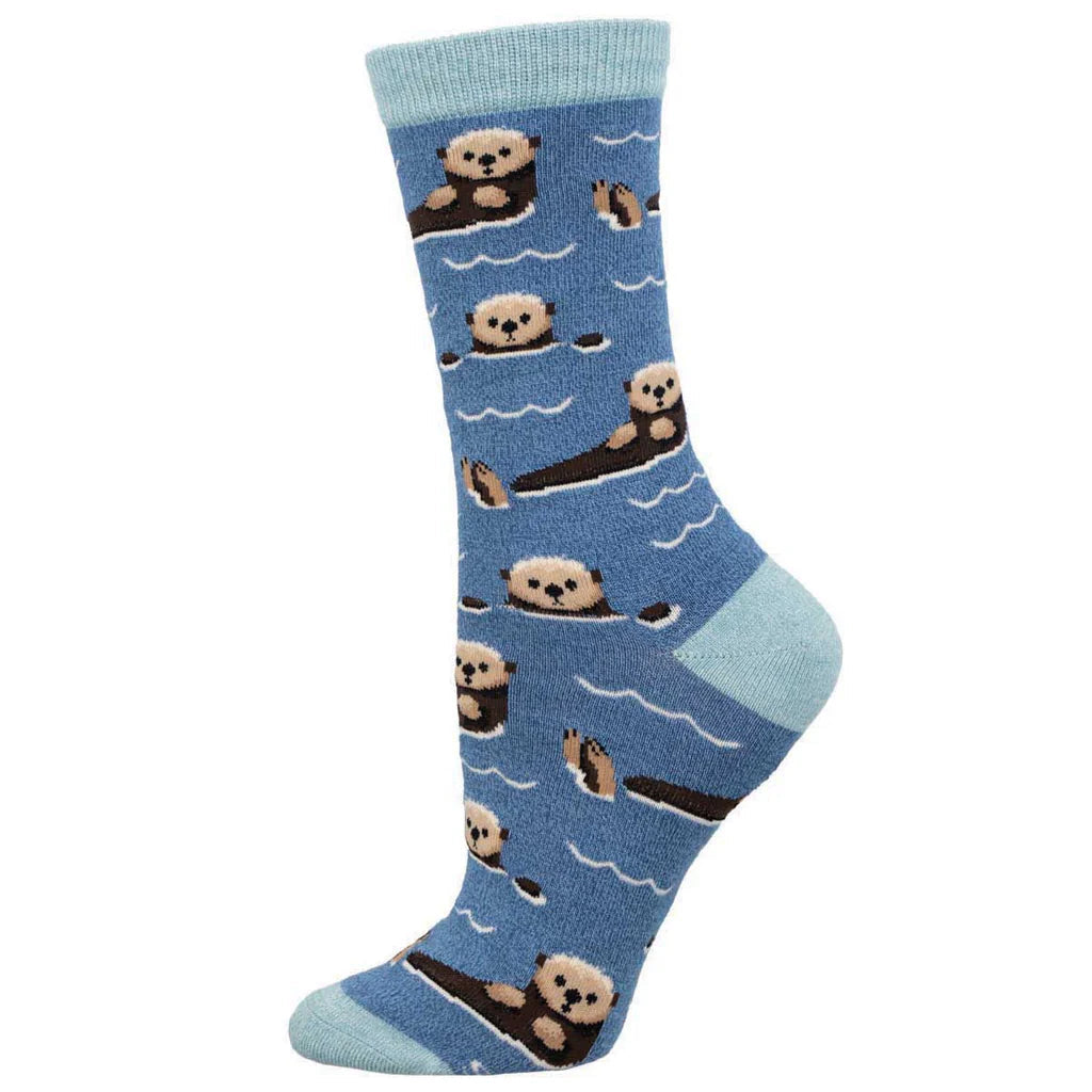 Women's sea otter crew socks in slate blue with wave lines, flat lay