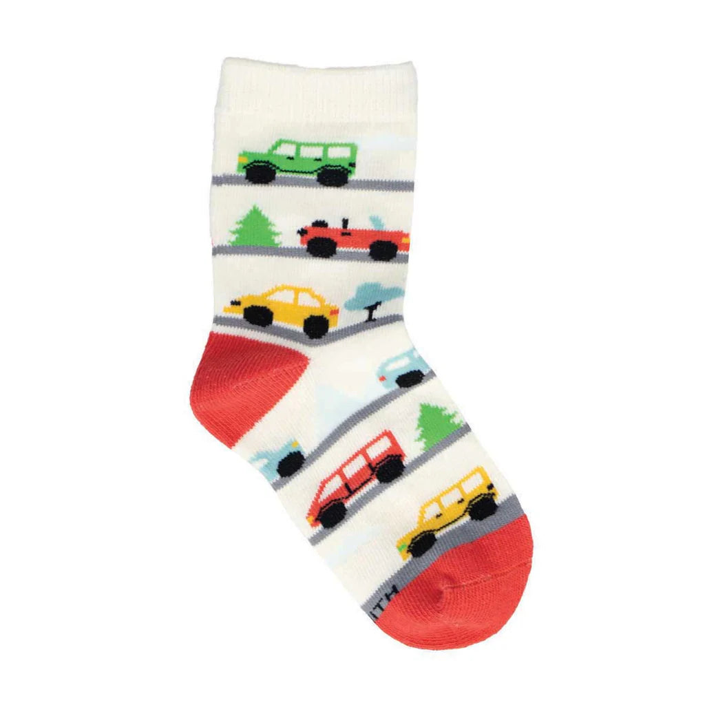 Kids' cream crew sock with colorful cars driving on gray roads, flat product shot