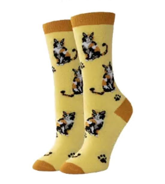 Women's calico cat crew socks in yellow, flat lay showing tricolor cats and paw prints