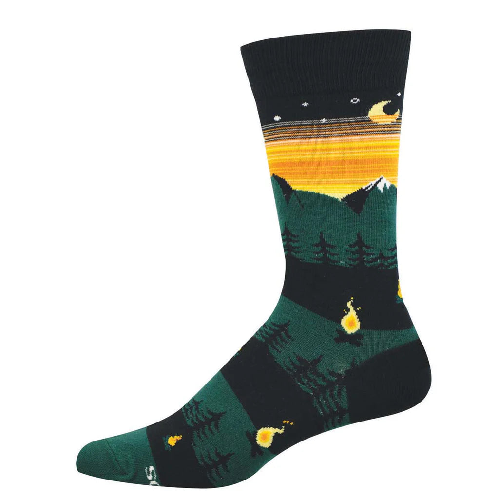 Men's campfire crew socks laid flat, dark with sunset, mountains, pine trees, and small fires