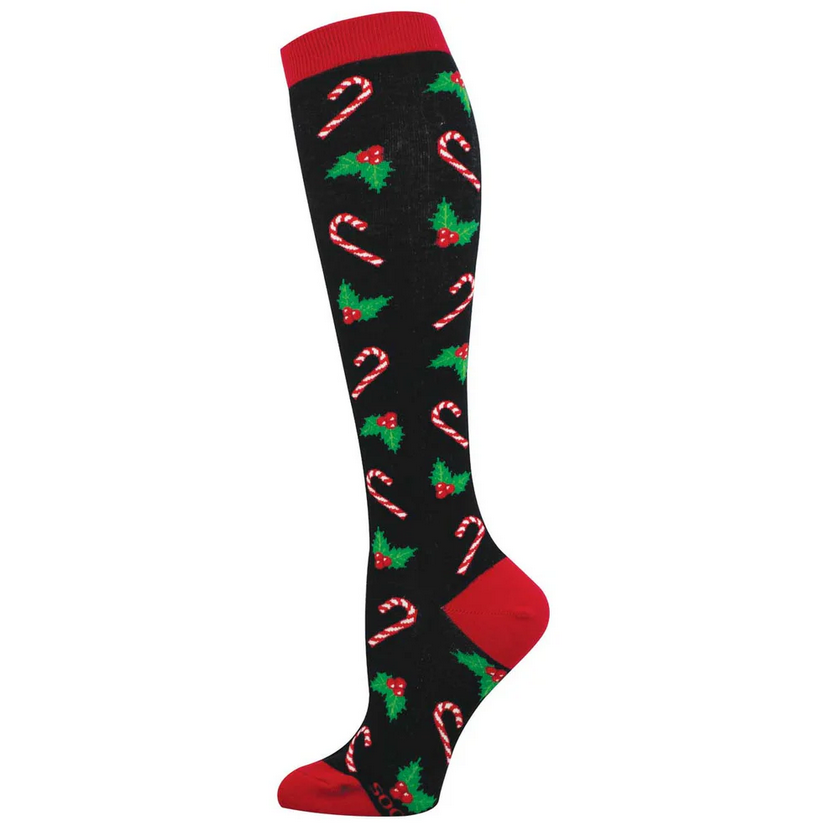 Women's candy cane and holly knee high socks in black, flat lay side view